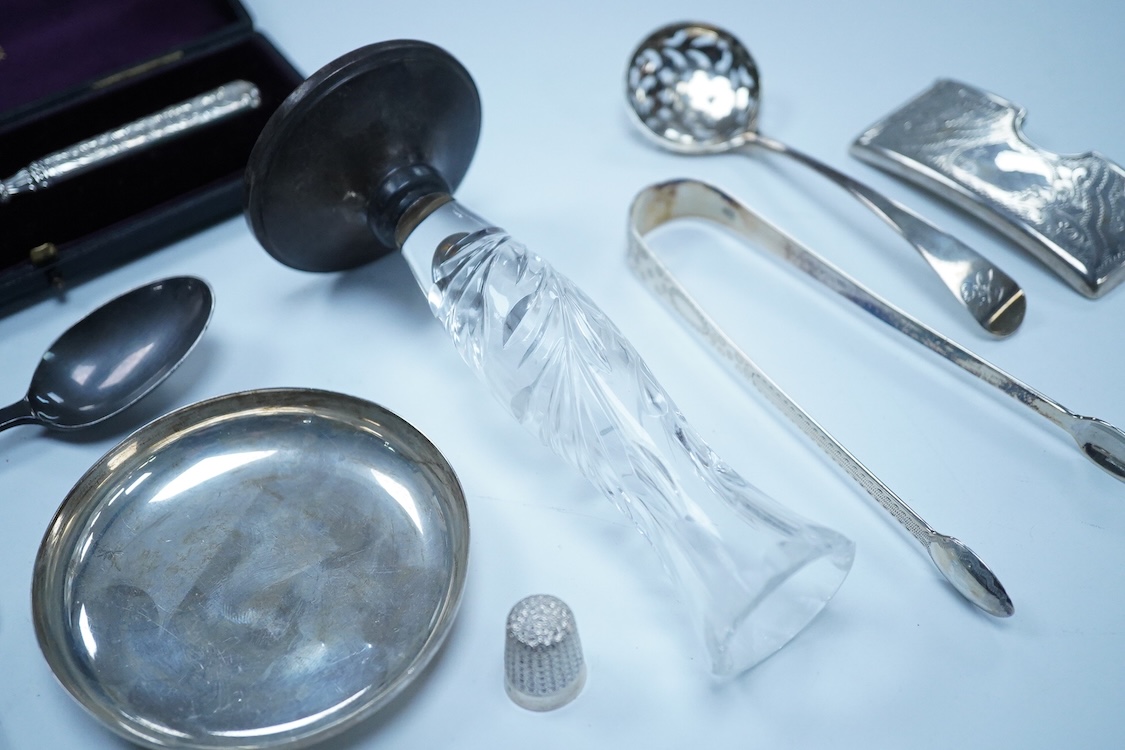 A collection of small silver to include a George V engraved concave card case, I. S. Greenberg & Co, Birmingham, 1912, 80mm, a cased late Victorian small bread fork, a modern mounted glass posy vase, an Irish nut dish, a